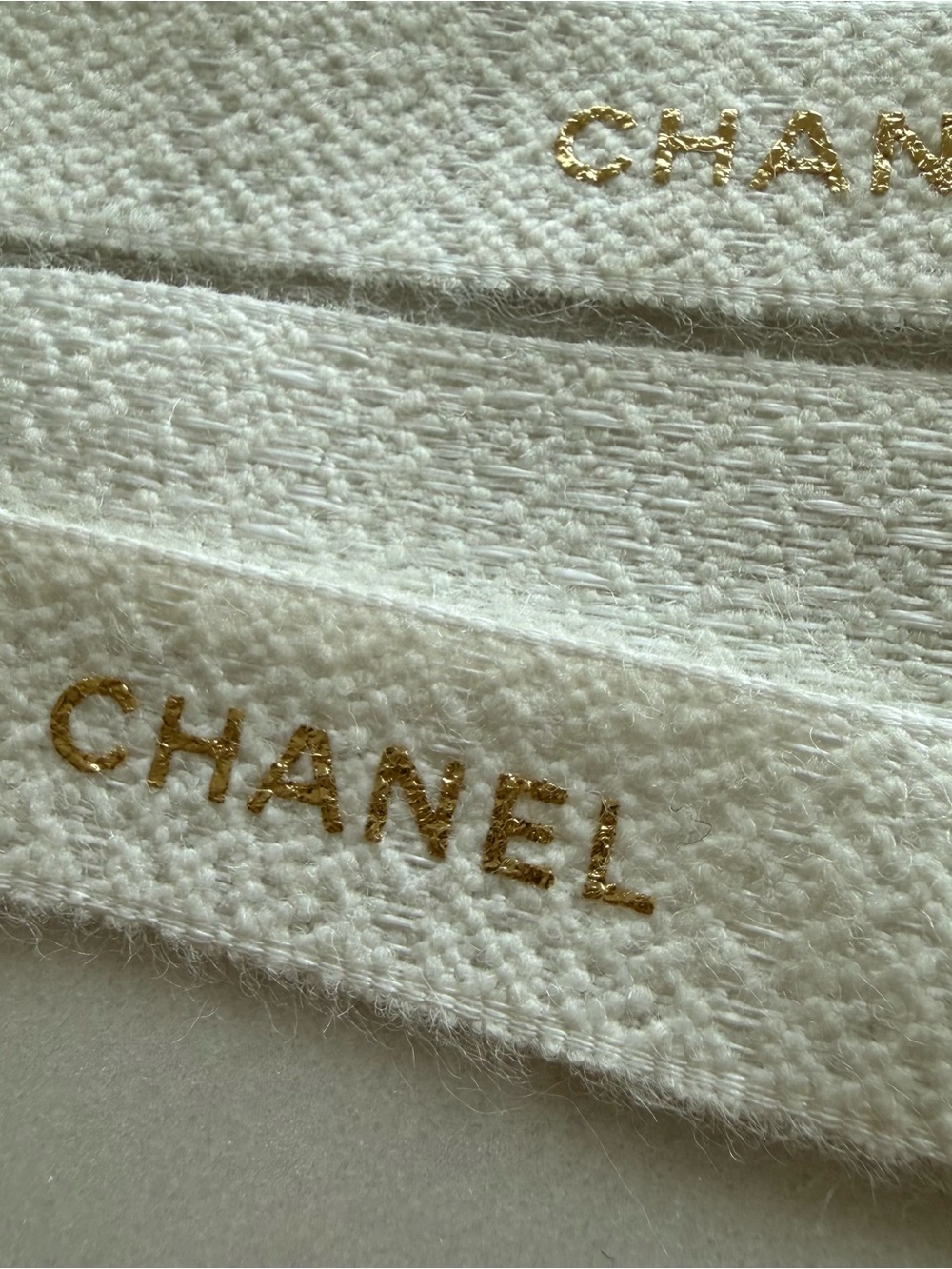42” CHANEL Cream Bouclé Ribbon with Gold Foil lettering